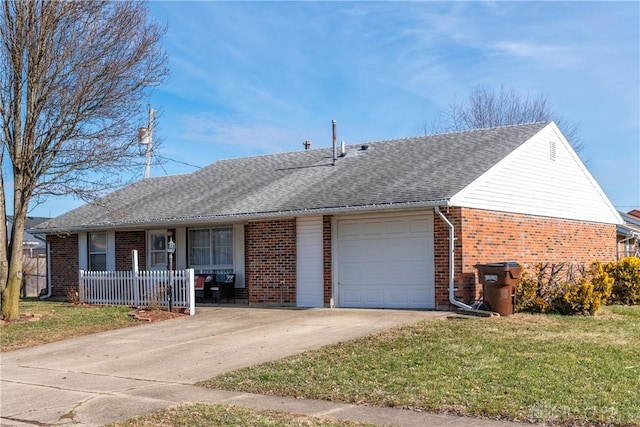 single story home featuring a garage and a front lawn