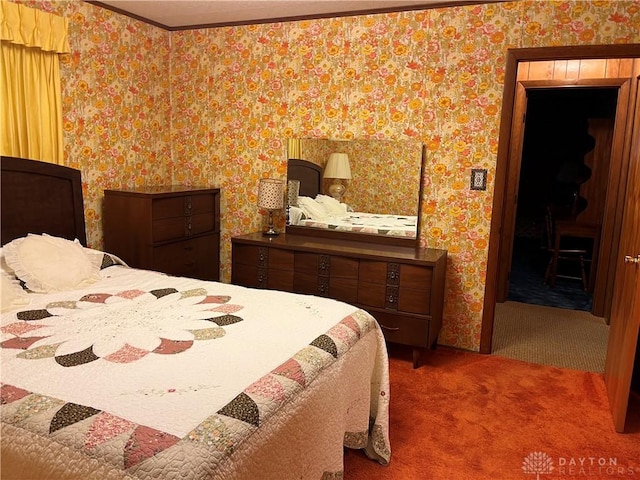 bedroom featuring dark colored carpet and crown molding