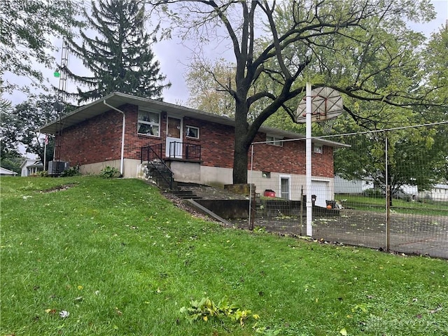 view of side of home featuring a yard