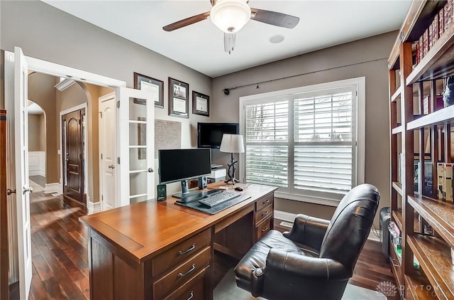 home office featuring dark hardwood / wood-style flooring and ceiling fan