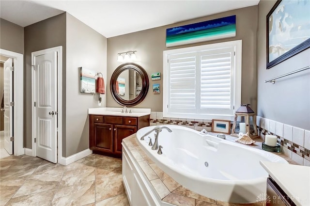 bathroom featuring vanity and tiled bath