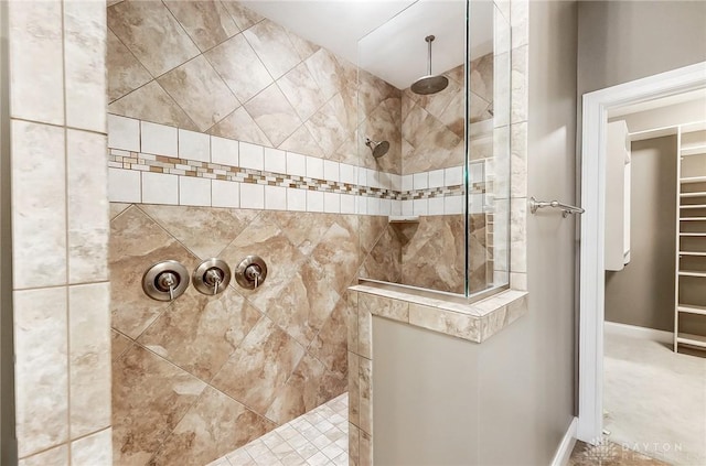 bathroom with a tile shower