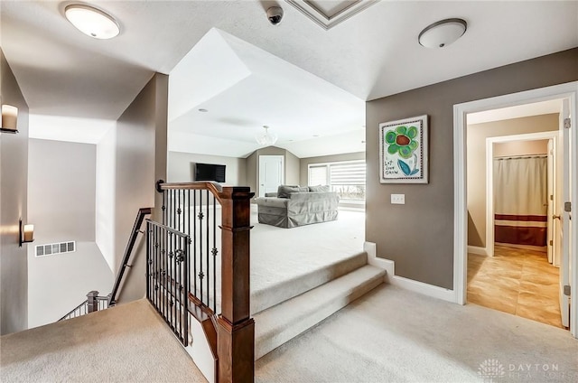 interior space featuring carpet and lofted ceiling