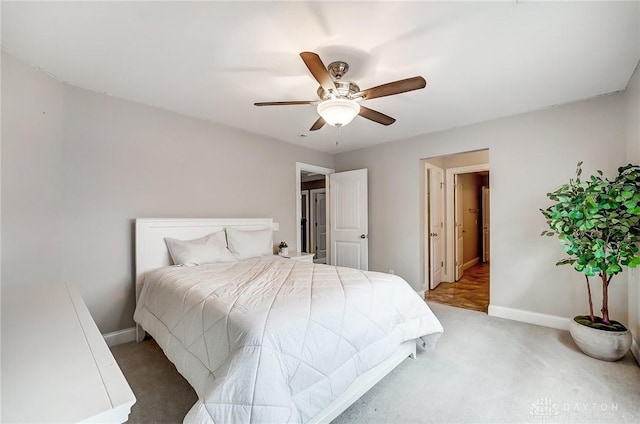 bedroom with ceiling fan and carpet floors