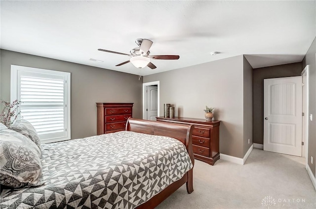 bedroom with light carpet and ceiling fan