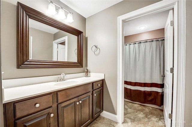 bathroom featuring a shower with curtain and vanity