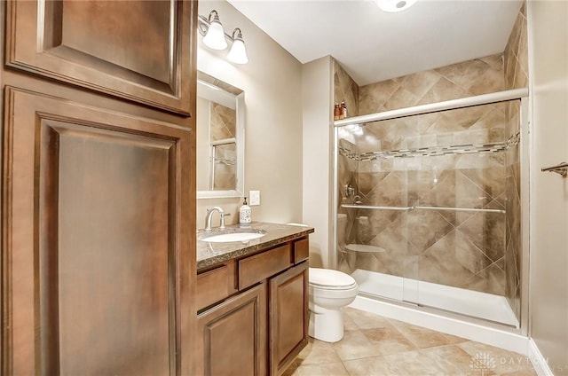 bathroom with vanity, toilet, and walk in shower