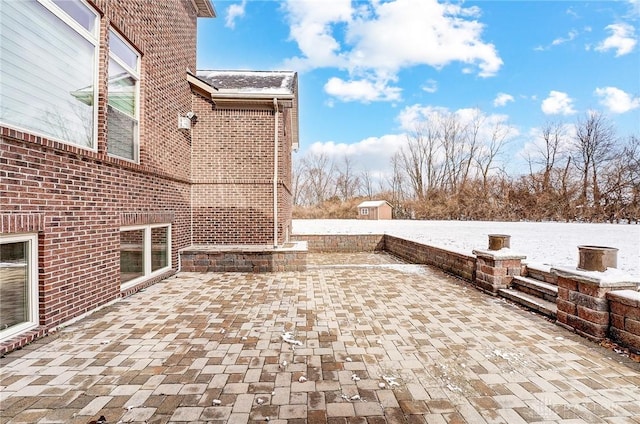 view of snow covered patio