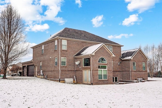 view of snow covered house