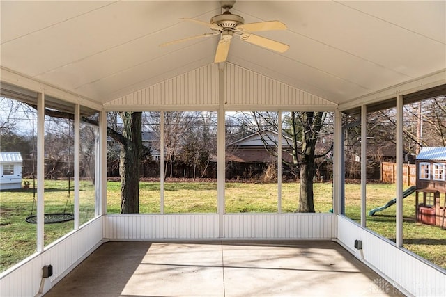 unfurnished sunroom with vaulted ceiling and ceiling fan