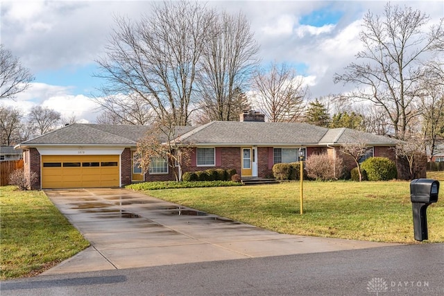 ranch-style house featuring a front yard and a garage