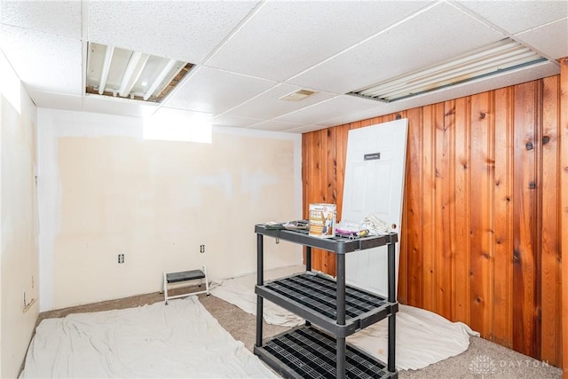 interior space featuring wood walls