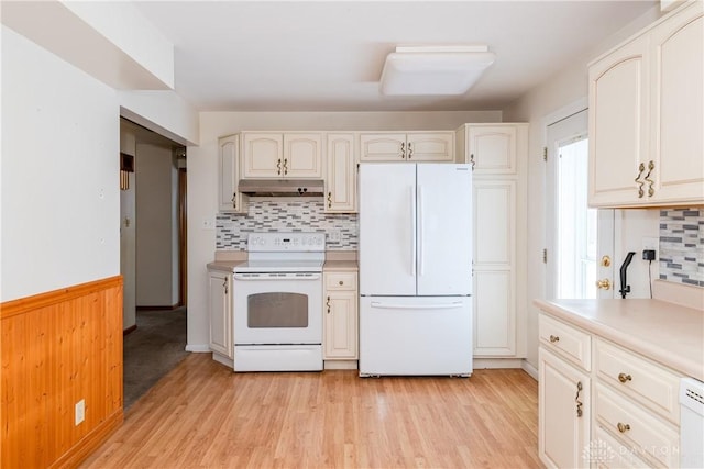 kitchen featuring light hardwood / wood-style floors, white appliances, white cabinetry, and tasteful backsplash