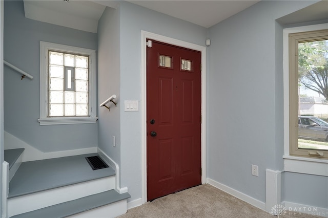 view of carpeted entrance foyer