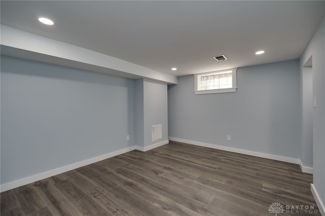 basement featuring dark hardwood / wood-style floors