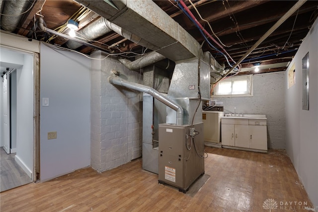 utility room featuring washer / dryer and heating unit