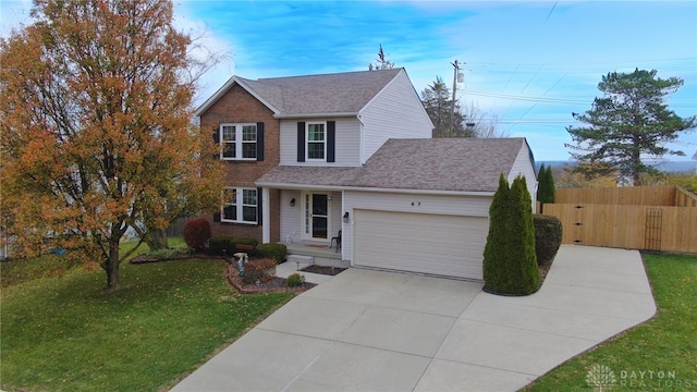 view of front facade featuring a garage and a front lawn