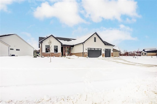 modern inspired farmhouse with a garage