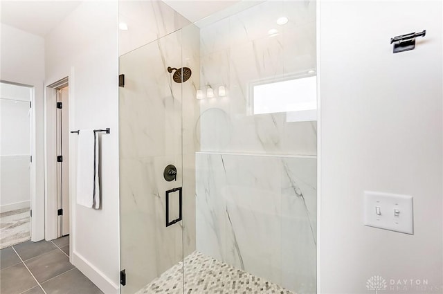 bathroom featuring tile patterned flooring and a shower with shower door