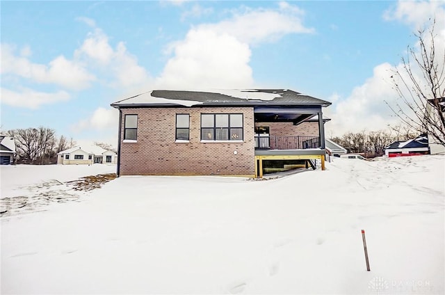 view of snow covered house