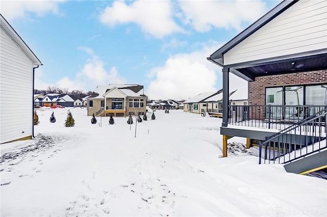 view of yard covered in snow