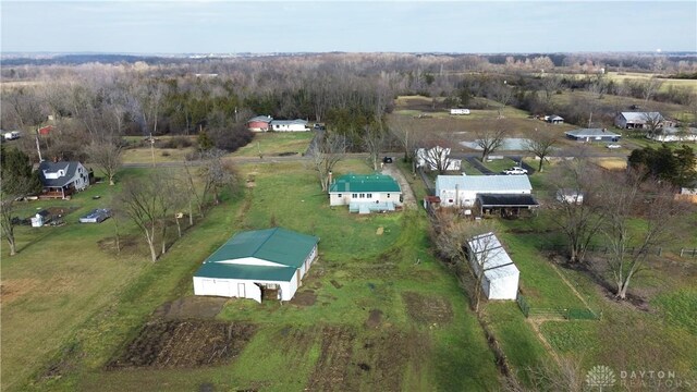 birds eye view of property with a rural view