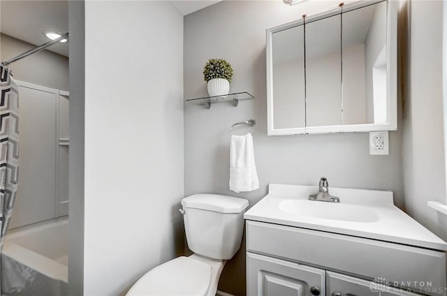 full bath featuring bathing tub / shower combination, vanity, and toilet