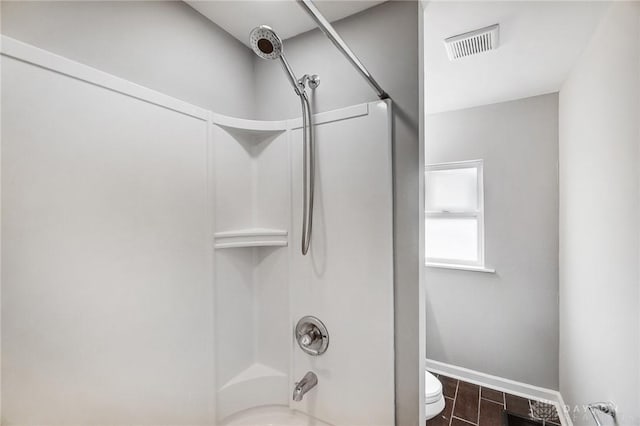 full bath featuring shower / tub combination, toilet, visible vents, baseboards, and wood tiled floor