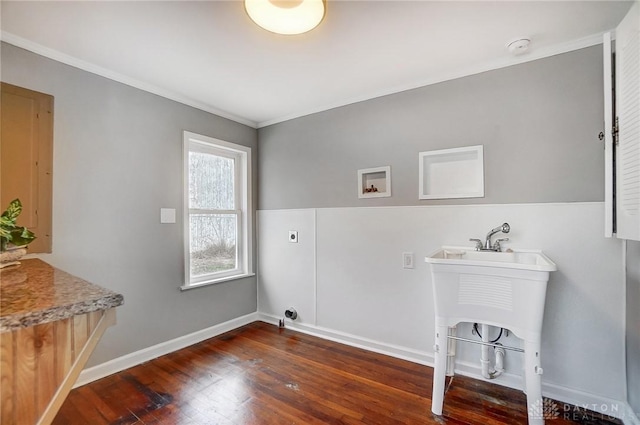 washroom with laundry area, baseboards, dark wood finished floors, ornamental molding, and hookup for a washing machine