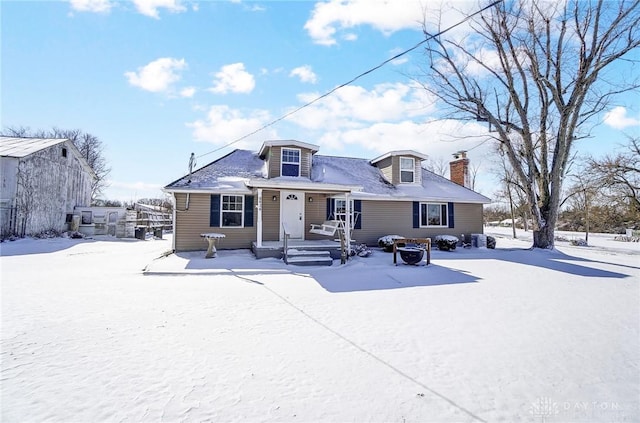 view of front of home with a chimney