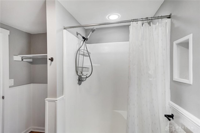 full bath featuring a wainscoted wall