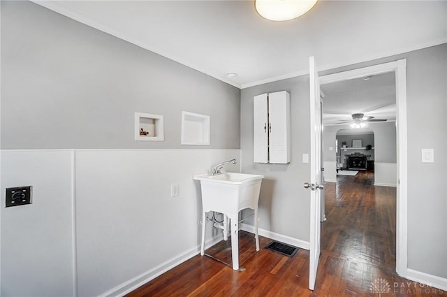 laundry area featuring laundry area, baseboards, ceiling fan, dark wood-style flooring, and washer hookup