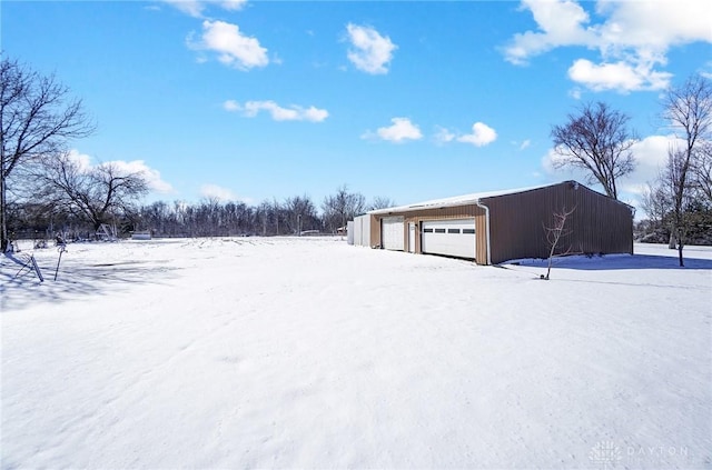 exterior space featuring an outdoor structure and a detached garage