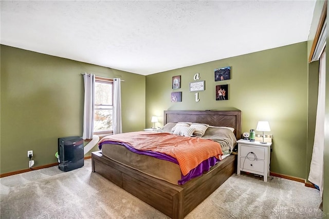 carpeted bedroom featuring a textured ceiling