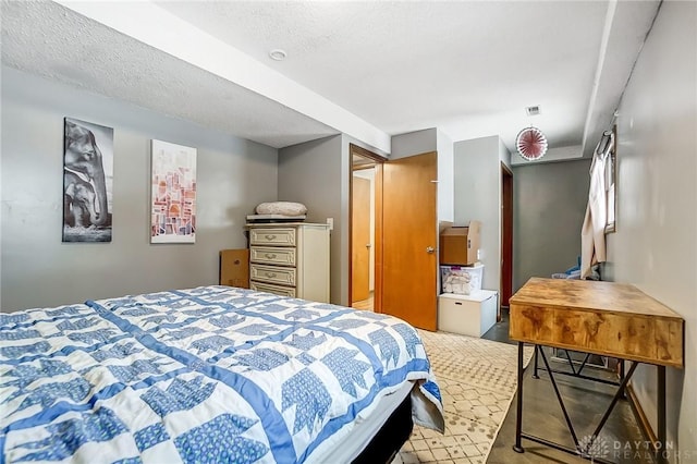 bedroom featuring a textured ceiling