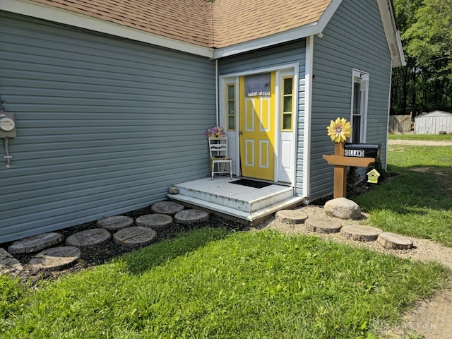 property entrance featuring a yard