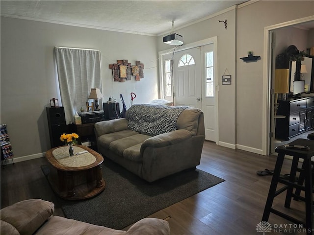 living room with dark hardwood / wood-style flooring and ornamental molding