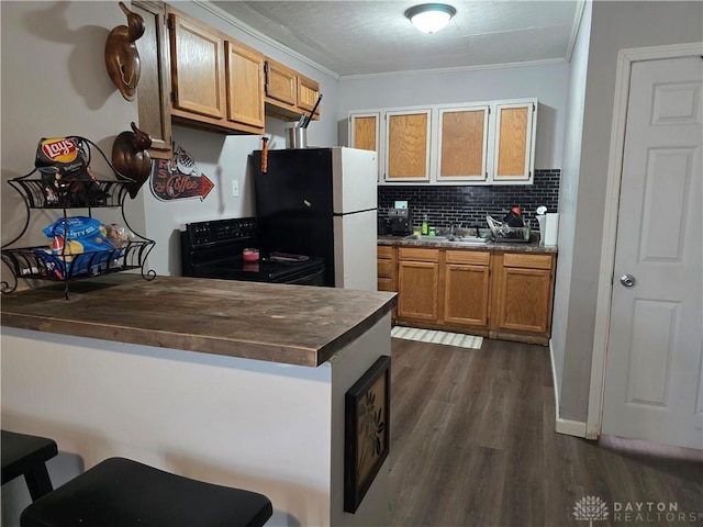 kitchen featuring white fridge, butcher block counters, ornamental molding, and black / electric stove