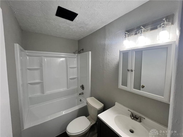 full bathroom featuring vanity, toilet, shower / tub combination, and a textured ceiling