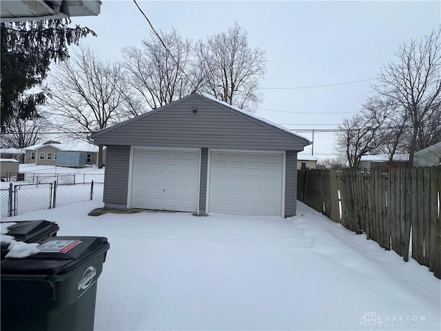 view of snow covered garage