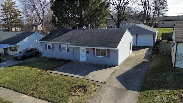 ranch-style home featuring an outbuilding, roof with shingles, a detached garage, and a front lawn