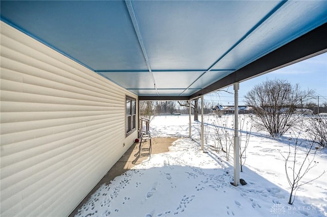 view of yard layered in snow