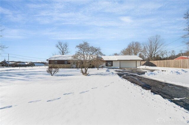 view of front of home with an outdoor structure and a garage