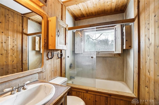 full bathroom with combined bath / shower with glass door, wood walls, toilet, vanity, and wood ceiling