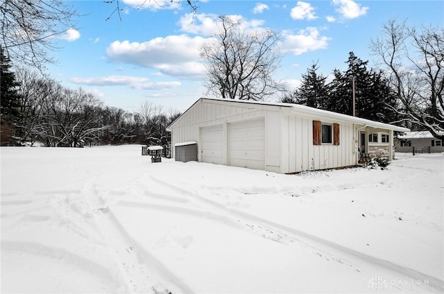 view of snow covered garage