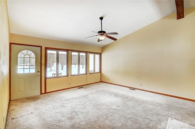 interior space featuring vaulted ceiling with beams, ceiling fan, and light colored carpet