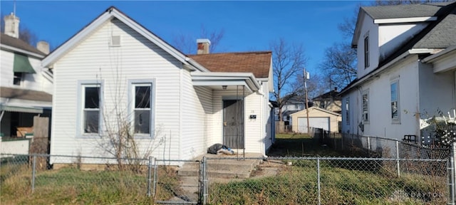 28 More Ave, Dayton, OH 45403 - view of front of property featuring a fenced front yard, a chimney, and roof with shingles