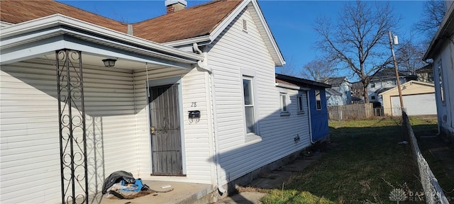28 More Ave, Dayton, OH 45403 - view of home's exterior with a chimney