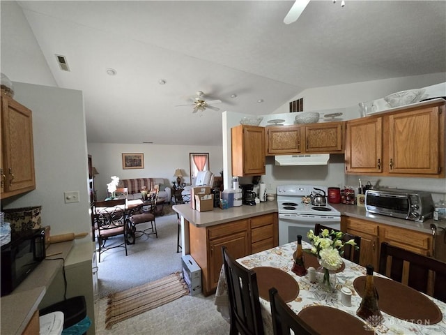 kitchen with lofted ceiling, electric stove, ceiling fan, light colored carpet, and kitchen peninsula