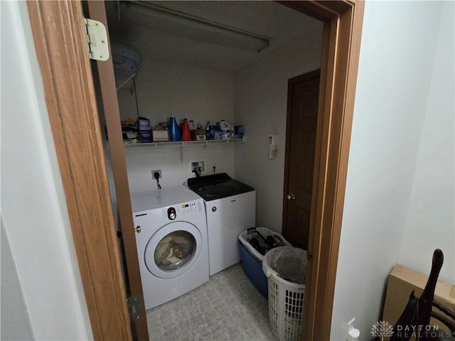 laundry room featuring washer and clothes dryer